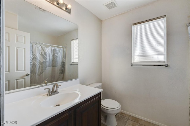 full bathroom featuring a wealth of natural light, visible vents, toilet, and tile patterned floors