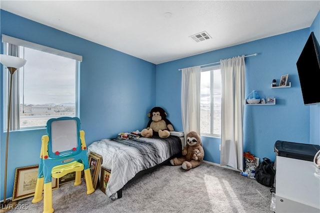 bedroom with carpet and visible vents