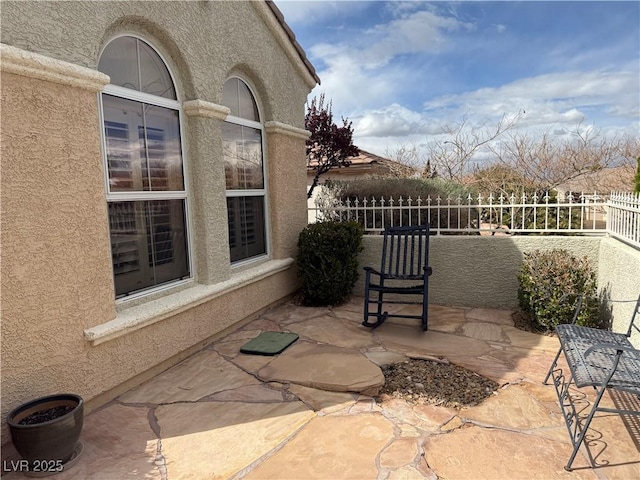 view of patio / terrace with fence