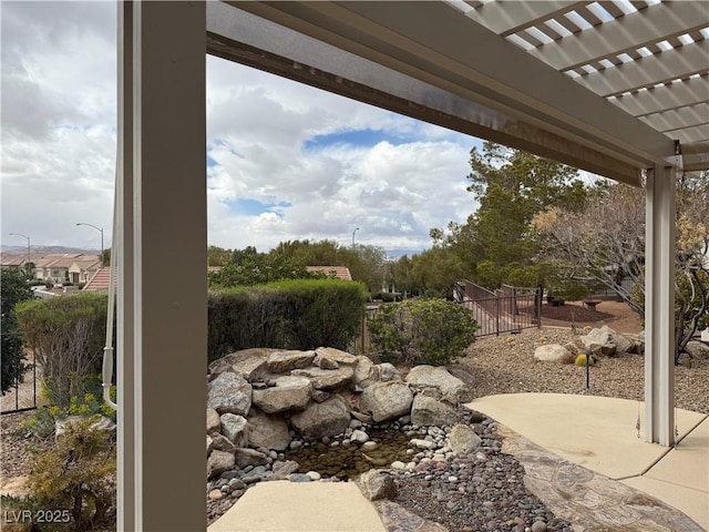 view of yard with a patio area, fence, and a pergola