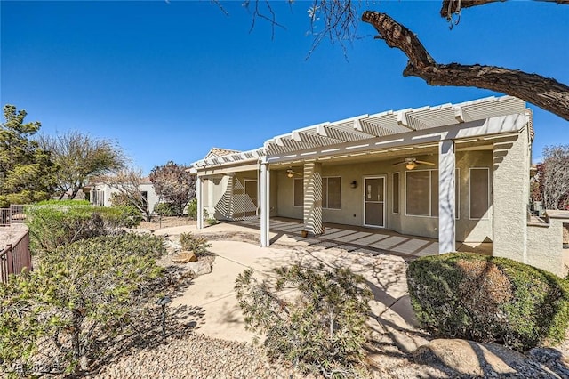 2715 Riceville Dr, Henderson, NV 89052 - rear view of property featuring ceiling fan, a pergola, a patio, and stucco siding