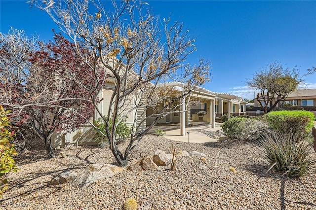 2715 Riceville Dr, Henderson, NV 89052 - back of house featuring a pergola, a patio area, and stucco siding