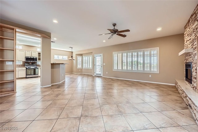 2715 Riceville Dr, Henderson, NV 89052 - unfurnished living room with ceiling fan, light tile patterned floors, a fireplace, recessed lighting, and baseboards