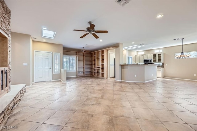 2715 Riceville Dr, Henderson, NV 89052 - unfurnished living room featuring light tile patterned floors, recessed lighting, a ceiling fan, a chandelier, and baseboards