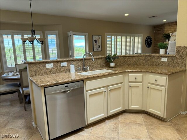 2715 Riceville Dr, Henderson, NV 89052 - kitchen featuring dishwasher, a sink, plenty of natural light, light stone countertops, and recessed lighting