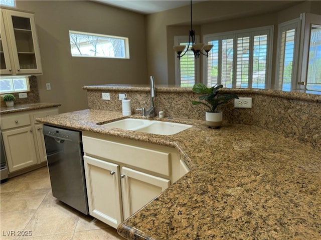 2715 Riceville Dr, Henderson, NV 89052 - kitchen with dishwashing machine, a sink, decorative backsplash, light stone countertops, and a chandelier