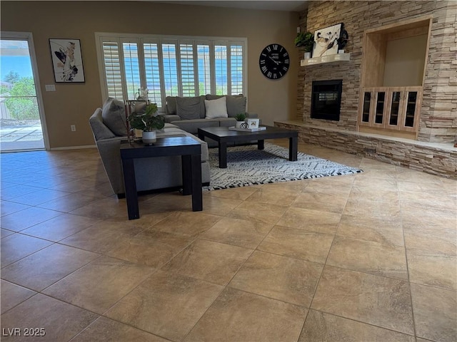2715 Riceville Dr, Henderson, NV 89052 - living room with a fireplace, baseboards, and tile patterned flooring