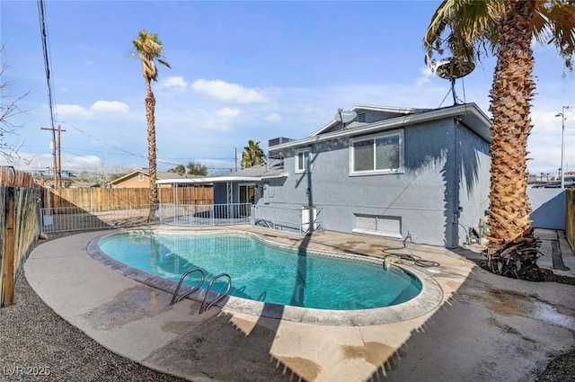 view of swimming pool with a fenced in pool, a patio area, and a fenced backyard