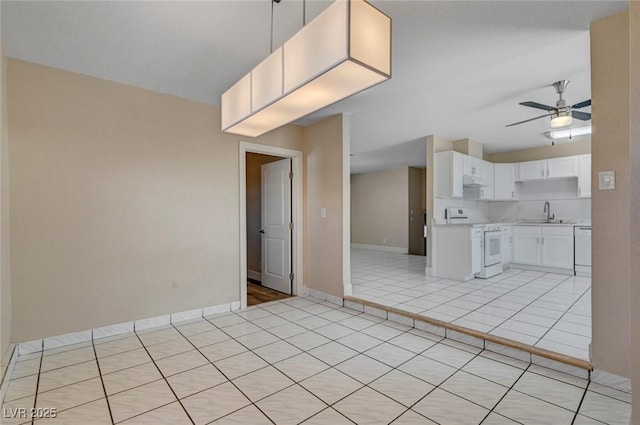 kitchen with light tile patterned floors, light countertops, white cabinets, white appliances, and under cabinet range hood