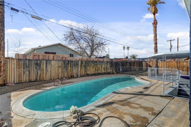 view of pool with a patio area, a fenced backyard, and a fenced in pool