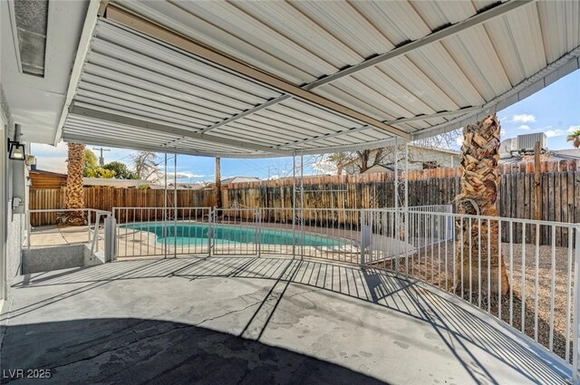 view of patio / terrace with a fenced backyard and a fenced in pool