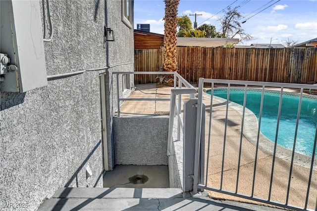 view of pool with a fenced backyard and a fenced in pool