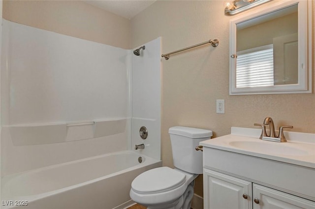 full bathroom featuring tub / shower combination, vanity, and toilet