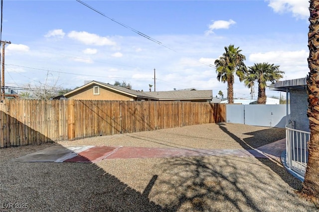 view of yard featuring a patio area and a fenced backyard