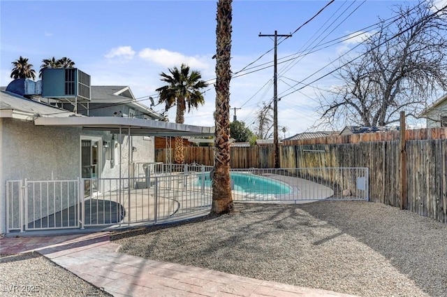 view of pool featuring a fenced in pool, cooling unit, a fenced backyard, and a patio