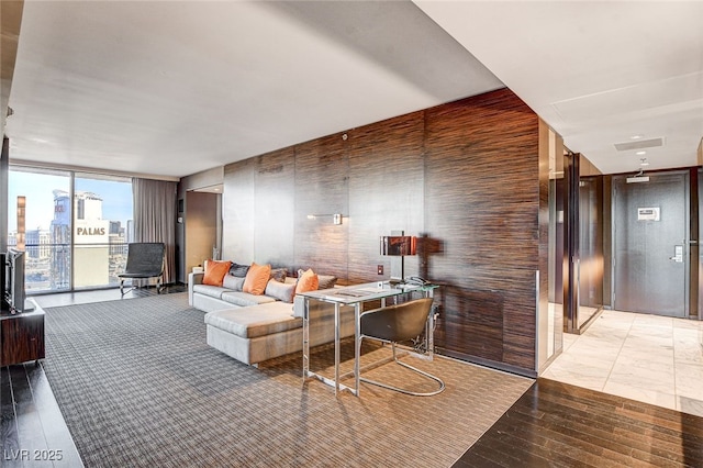 living area featuring expansive windows and light wood-style floors