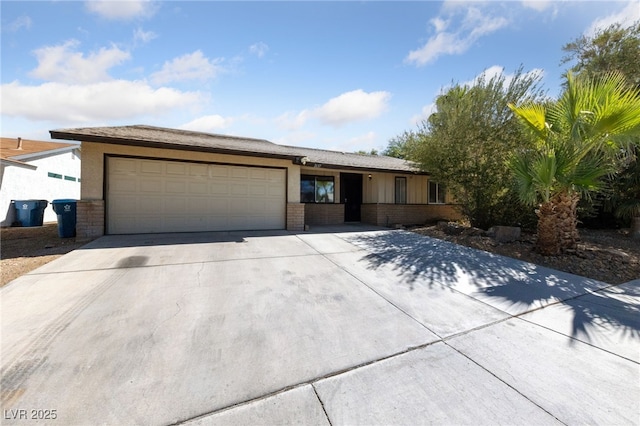 ranch-style house featuring driveway and an attached garage