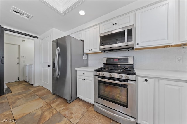 kitchen featuring recessed lighting, visible vents, backsplash, appliances with stainless steel finishes, and white cabinetry