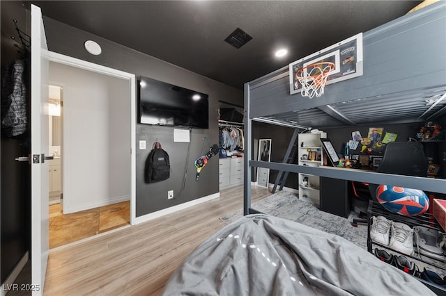 interior space featuring wood finished floors and baseboards