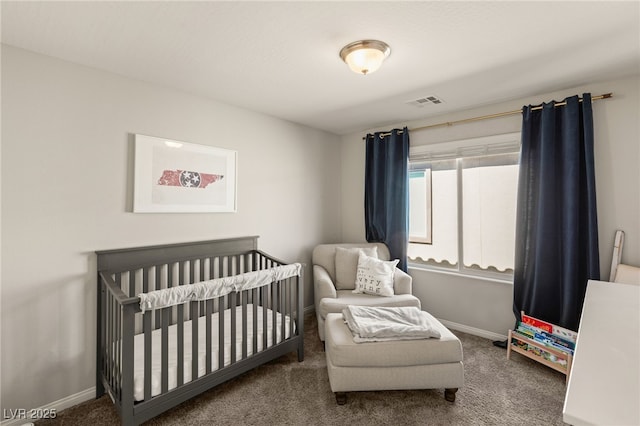 carpeted bedroom with a nursery area, visible vents, and baseboards