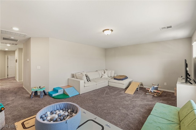 living room with carpet, visible vents, and baseboards