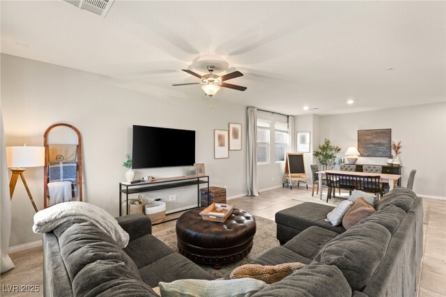 living area featuring ceiling fan, recessed lighting, visible vents, and baseboards