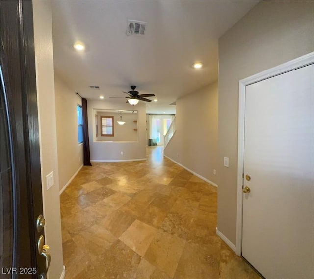 interior space with baseboards, visible vents, a ceiling fan, and recessed lighting