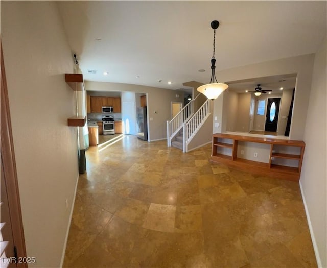 unfurnished living room with visible vents, stairs, baseboards, and recessed lighting