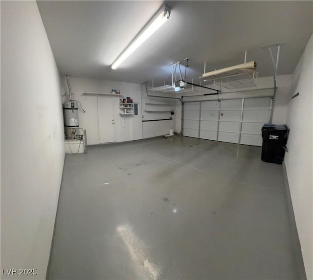 garage with strapped water heater and a garage door opener