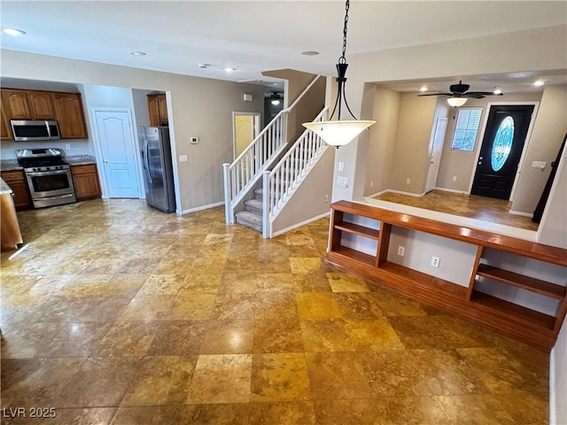 kitchen with ceiling fan, recessed lighting, stainless steel appliances, baseboards, and pendant lighting