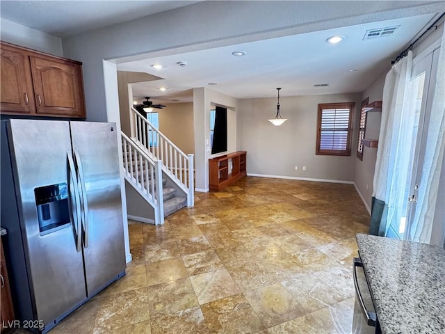 kitchen featuring recessed lighting, visible vents, ceiling fan, stainless steel fridge, and baseboards