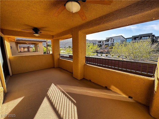 sunroom / solarium featuring ceiling fan