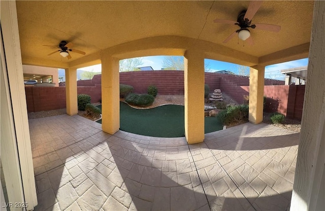 view of patio featuring ceiling fan and a fenced backyard