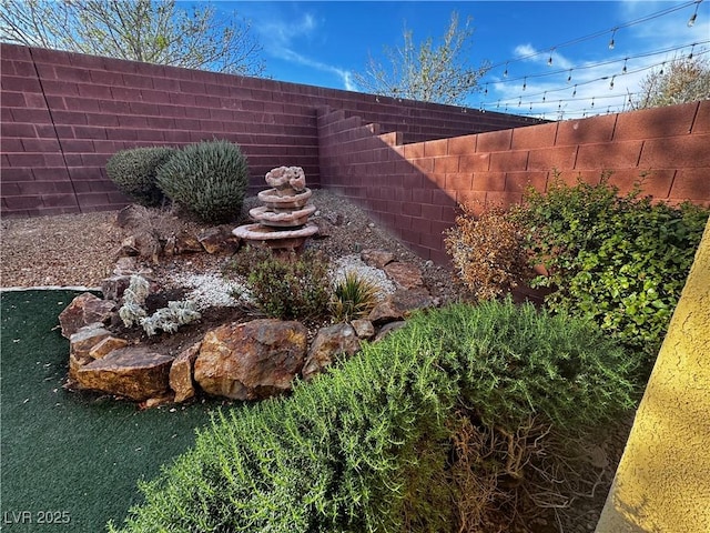 view of yard featuring fence