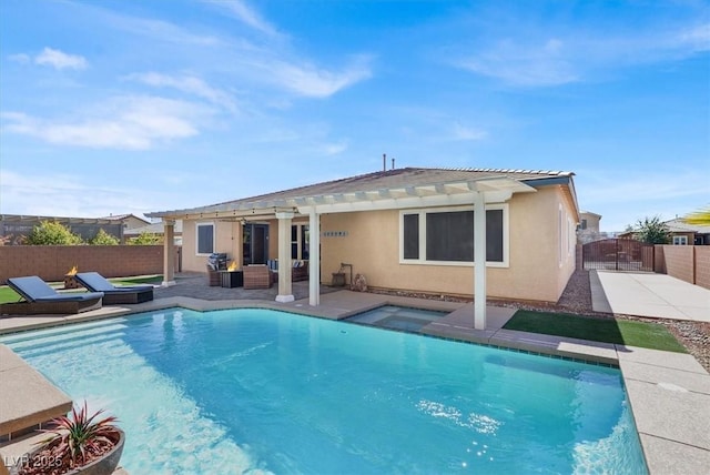 rear view of property with a patio area, fence, a jacuzzi, and stucco siding