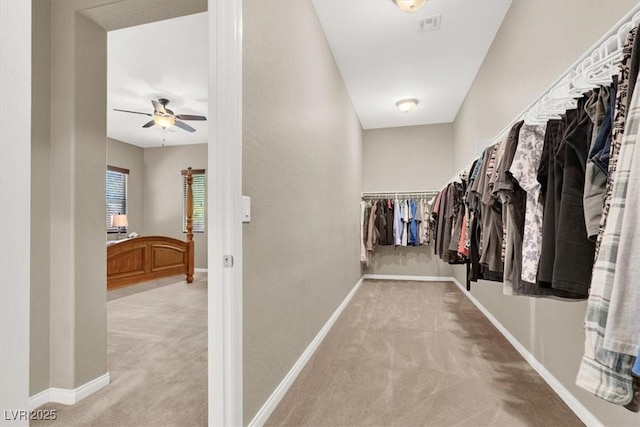 spacious closet featuring carpet floors and ceiling fan