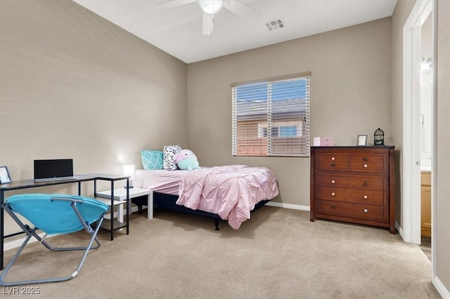 carpeted bedroom with a ceiling fan, visible vents, and baseboards