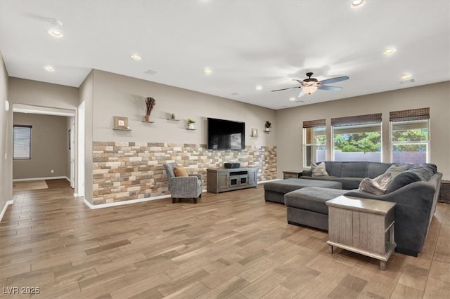 living area featuring light wood-style floors, recessed lighting, visible vents, and a ceiling fan