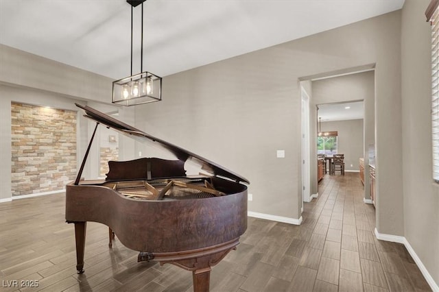 living area with wood finish floors and baseboards