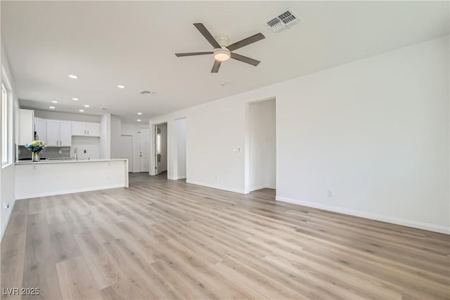 unfurnished living room featuring ceiling fan, recessed lighting, visible vents, baseboards, and light wood finished floors