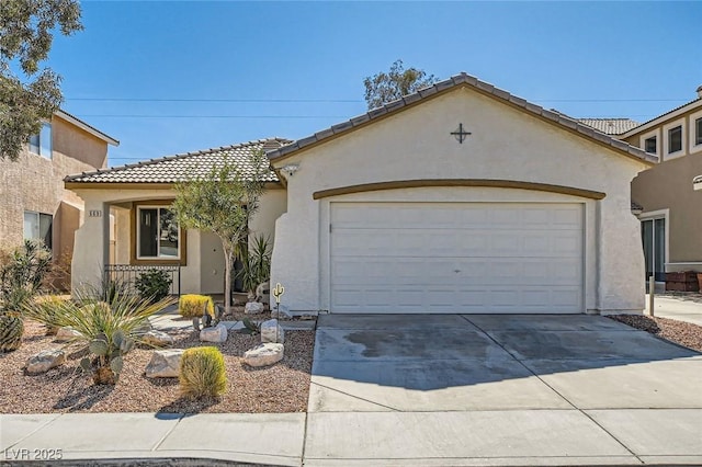 mediterranean / spanish-style house with stucco siding, concrete driveway, an attached garage, and a tiled roof