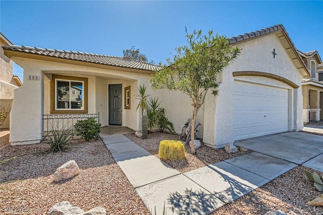 view of front of property featuring covered porch, a tiled roof, a garage, and stucco siding