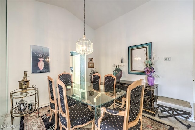 dining area with a chandelier and high vaulted ceiling