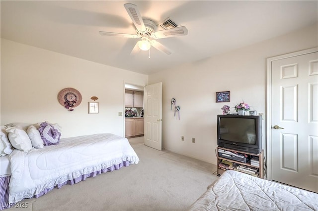 bedroom featuring light colored carpet and ceiling fan