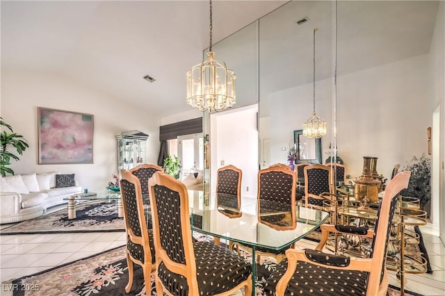 dining space with visible vents, a notable chandelier, and tile patterned floors