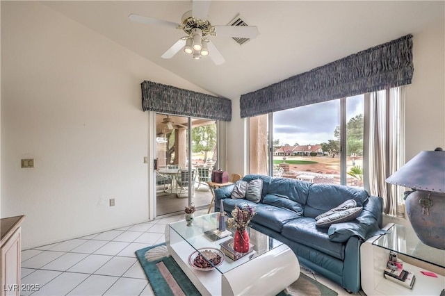 living area featuring light tile patterned floors, ceiling fan, and vaulted ceiling