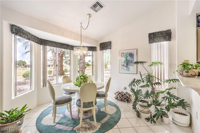 dining space featuring lofted ceiling, visible vents, a notable chandelier, and light tile patterned flooring