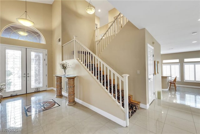 8925 Rio Verde Ave, Las Vegas, NV 89147 - foyer with a high ceiling, french doors, visible vents, and baseboards