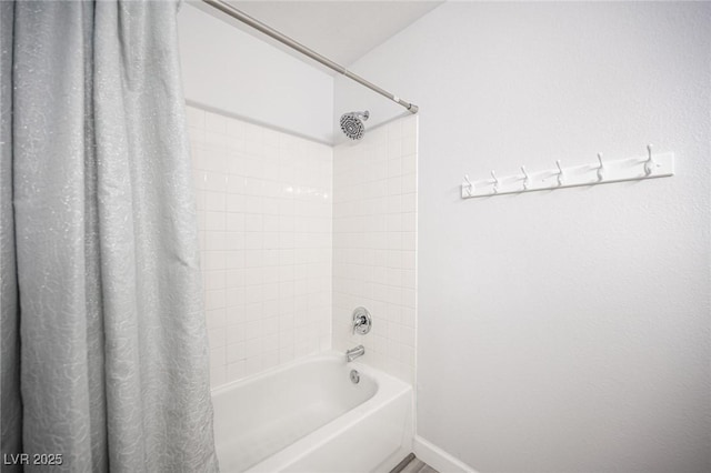 full bathroom with shower / bath combo with shower curtain and baseboards