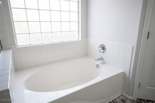 bathroom with a garden tub